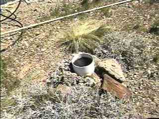 View of rain gauge mounted in rocks